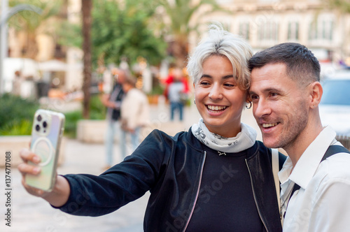 Happy and joyful people enjoying a selfie in a vibrant urban setting that showcases life