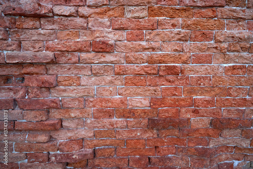 Old red brick background at natural light