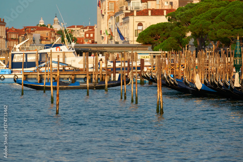 Gondolas on the quay in the lagoon. Venice, Italy