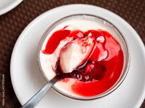 Photos Vegan Panna cotta with cranberry sauce. Healthy vegan dessert