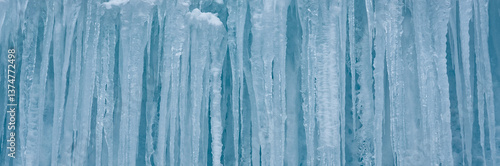 Cold winter icicles melting banner. Blue frozen ice close-up photograph. 	