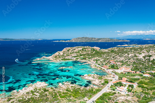 Turquoise waters and rugged coastline seen from above Punta Tegge, La Maddalena Island. Sardinia, Italy