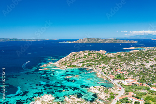 Turquoise waters and rugged coastline seen from above Punta Tegge, La Maddalena Island. Sardinia, Italy