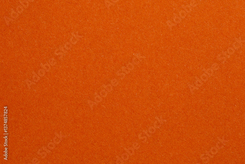 The orange background is a solid color with no pattern, textured origami paper backdrop