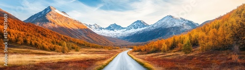 Obraz na płótnie Autumnal Mountain Path Scenic valley road leading to majestic snowcapped peaks, ideal for travel brochures w salonie
