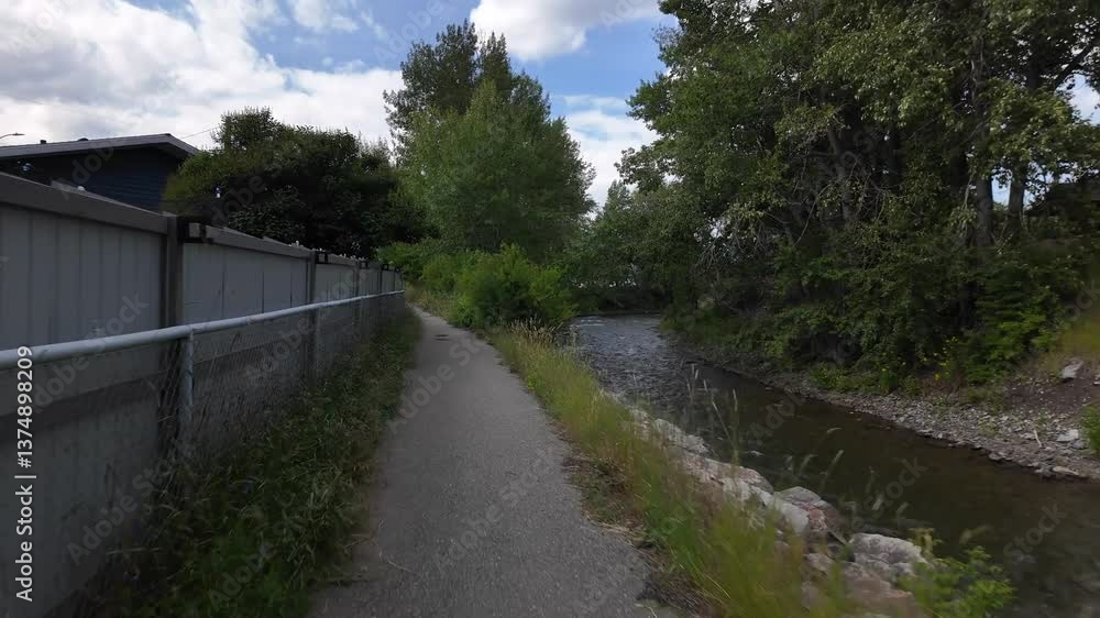 Walking Path Along a River in Canmore, Alberta, Canada, on a Sunny Summer Day