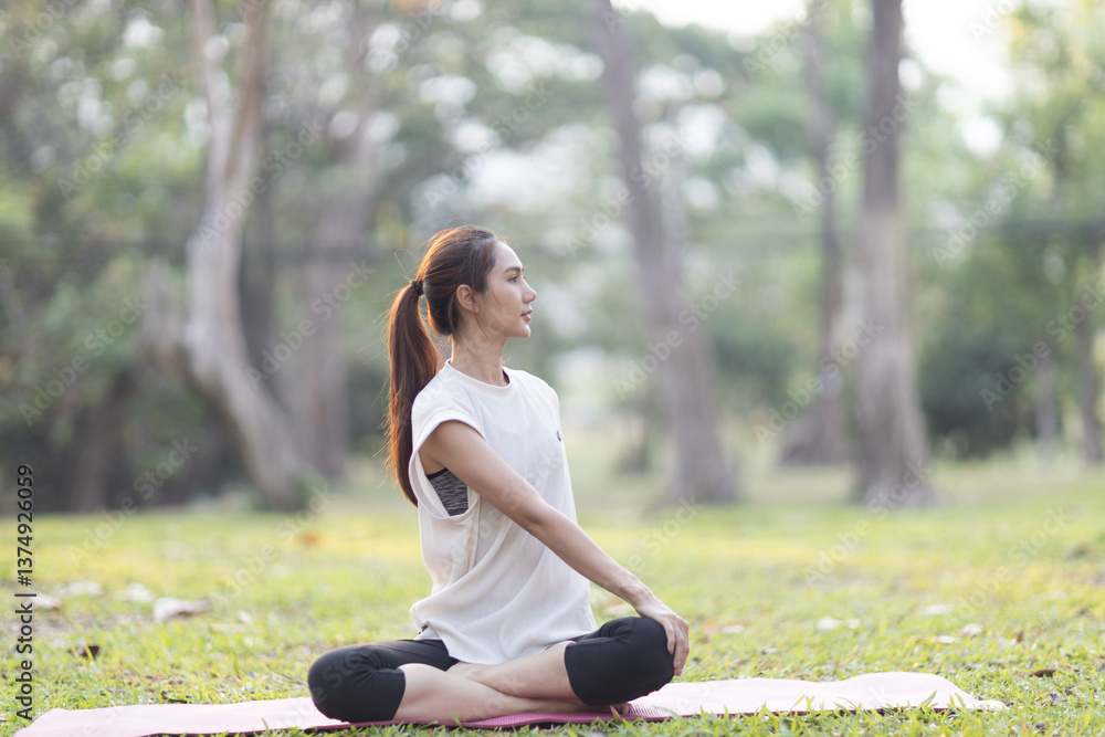 A enthusiastic Asian sports woman stopped after exercising at the garden, sitting on a exercise mat, inhaling deeply by closing her eyes. Sports and exercise regularly Health and health A enthusiastic Asian sports woman stopped after exercising at the garden, sitting on a exercise mat, inhaling deeply by closing her eyes. Sports and exercise regularly Health and health
