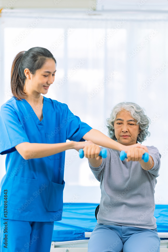 Obraz premium Elderly woman receives medical services from home care nurse while performing muscle strengthening exercises.