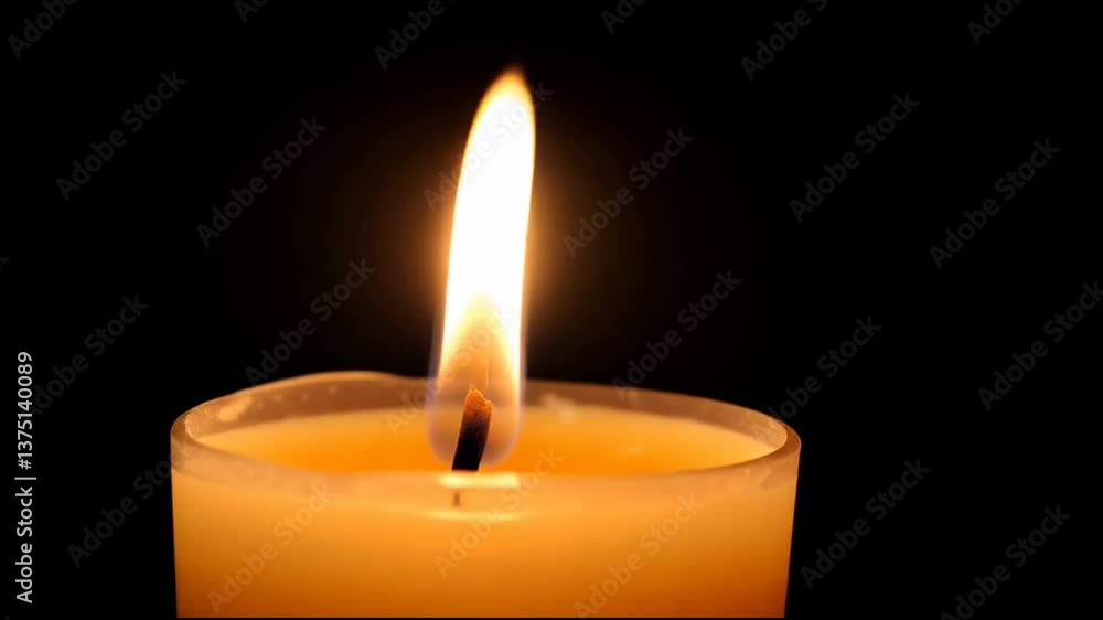 Romantic candlelight softly flickering against black backdrop Romantic candlelight softly flickering against black backdrop