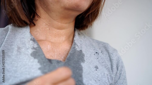 sweating woman feeling extremely tired and overheated during a summer heatwave, breathing quickly and possibly experiencing heatstroke due to high temperatures