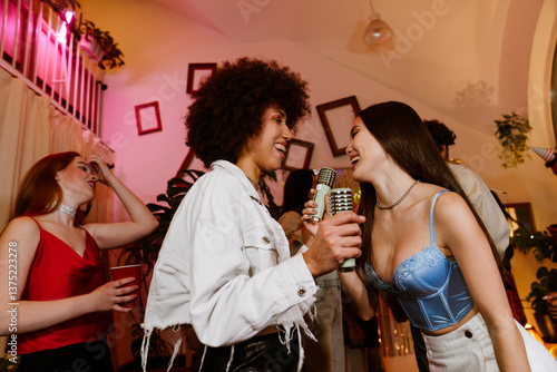 Canvas Print A young Latina woman in her late 20s, dancing and singing into wireless micropho