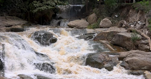 waterfall in the mountains forest.