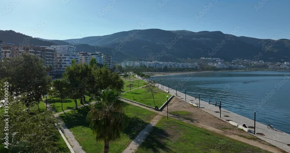 A beautiful aerial view of Vlore, Albania, showcasing the serene beach and surrounding buildings A beautiful aerial view of Vlore, Albania, showcasing the serene beach and surrounding buildings