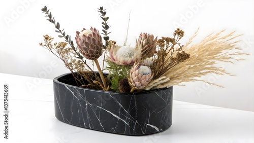 Minimalist Black Marble Planter with Exotic Dried Florals, Isolated on a White Background, perfect for contemporary interior styling and luxury botanical decor, Luxury Home Accessory Stock Image