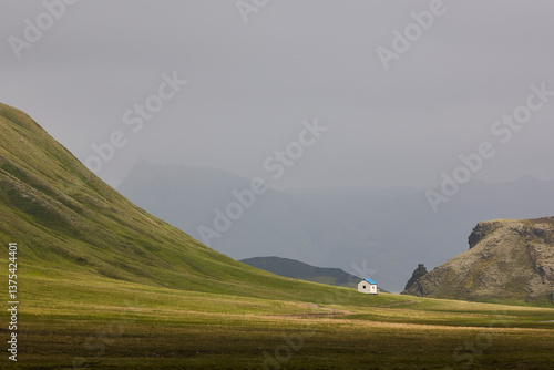 Obraz na płótnie Picturesque shelter in a green misty landscape. Icelandic loneliness scenery w salonie