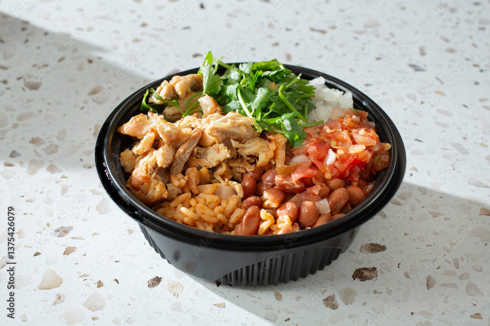 A view of a Mexican chicken bowl. A view of a Mexican chicken bowl.