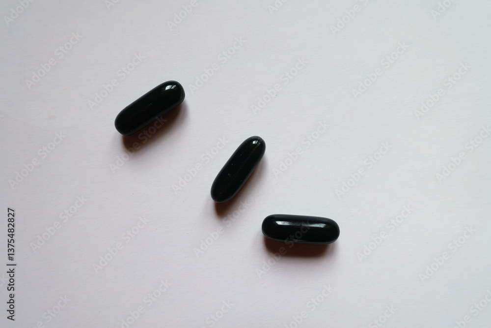 black softgel capsules of activated charcoal (three items)