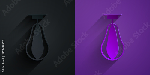 Paper cut Punching bag icon isolated on black on purple background. Paper art style. Vector