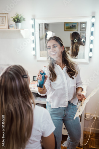 Wallpaper Mural Professional beautician applying makeup on beautiful young woman's face. Professional make up studio work with gorgeous female model. Torontodigital.ca