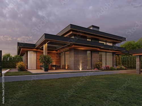 Modern house with flat roof and panoramic windows. Exterior. Evening illumination of the facade. House with swimming pool and large terrace. Modern architecture