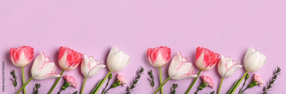 Obraz premium Many beautiful flowers on lilac background, top view