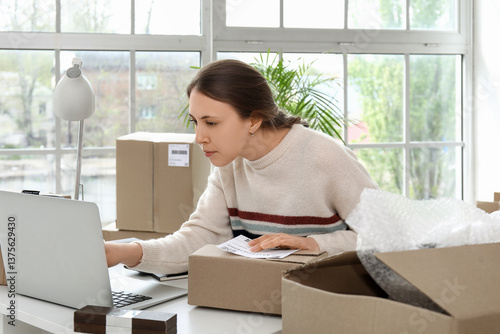 Young woman with parcel for...