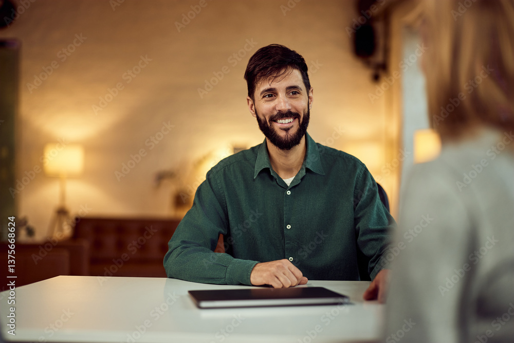 Smiling Business Professional Having Meeting at Office Desk Smiling Business Professional Having Meeting at Office Desk