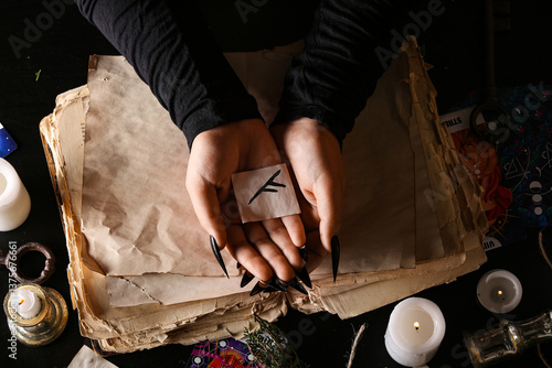 Witch with rune on dark tab...