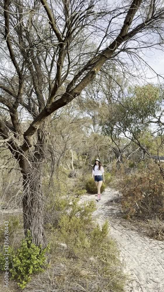 happy adventurous girl hikes and explores dry australian bush. Beautiful Aldinga Conservation Park next to aldinga beach, adelaide, south australia. happy adventurous girl hikes and explores dry australian bush. Beautiful Aldinga Conservation Park next to aldinga beach, adelaide, south australia.