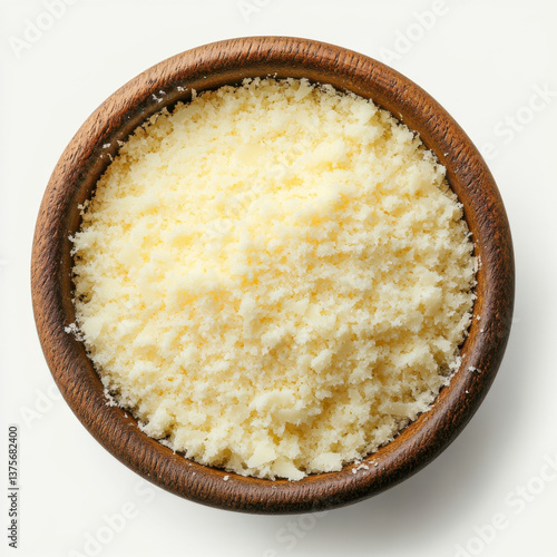Top view of photorealistic grated Parmesan cheese in a bowl, captured with studio lighting on a white background.