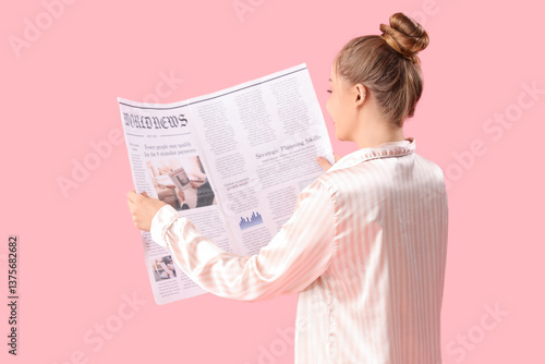 Young woman in pajamas read...