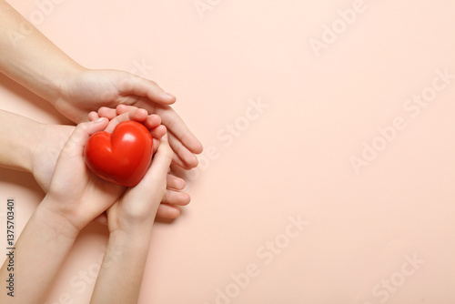 Hands of woman and child ho...