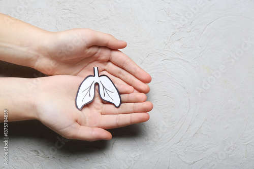 Child's hands holding paper...
