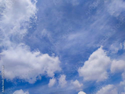 Bright Blue Sky with Moving White Clouds