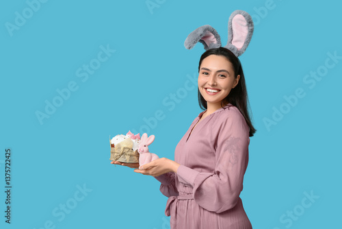 Happy young woman in bunny ...