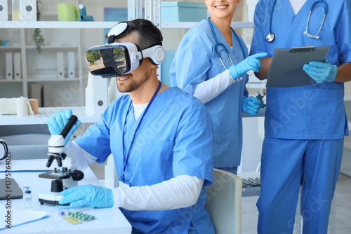 Male doctor with microscope...