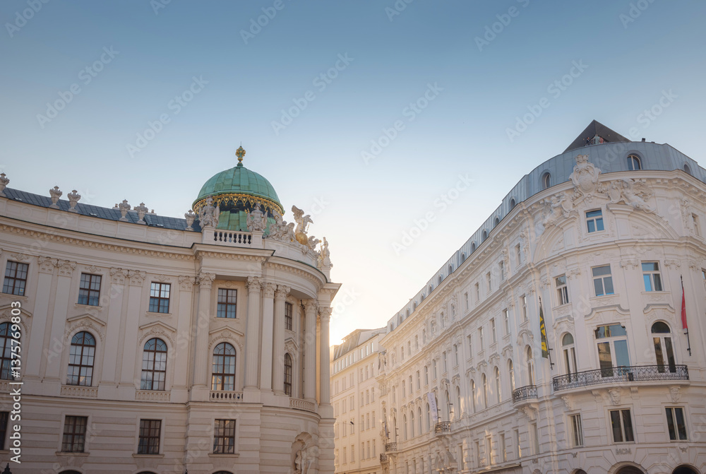 Obraz premium Summer trip to Vienna: exploring city beauty. Hofburg palace on St. Michael square Michaelerplatz, Vienna, Austria. Hofburg - famous Austrian historic landmark in city centre, scenic travel photo.