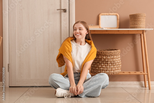 Smiling young woman sitting...