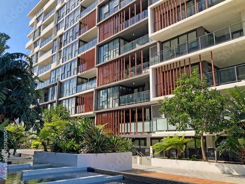Modern apartment block with courtyard in foreground