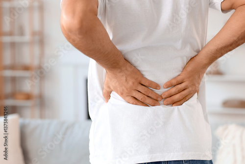 Man experiencing lower back...