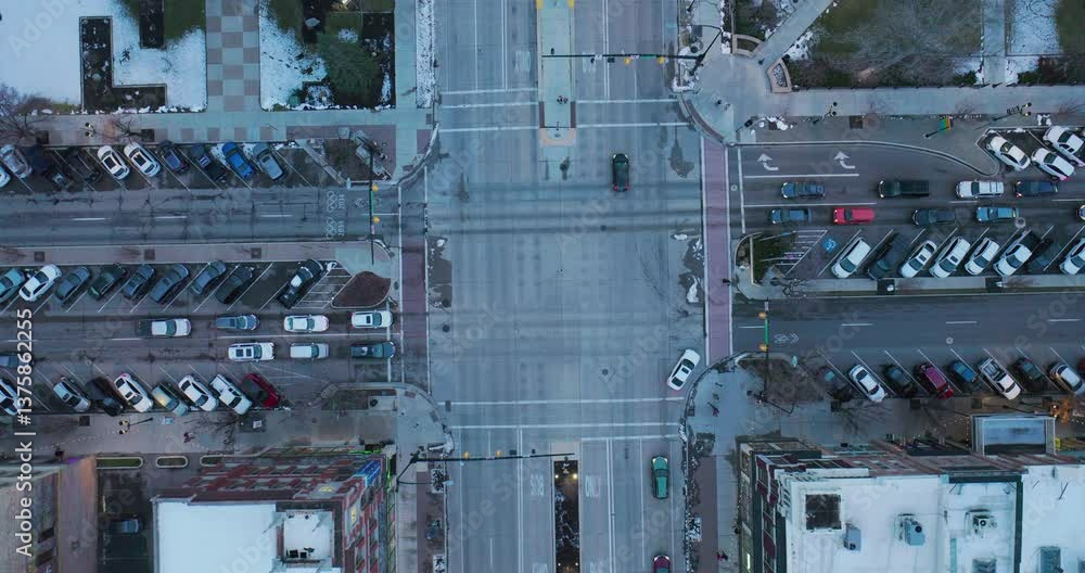 Traffic moving through large intersection - epic high, drone shot