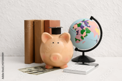 Piggy bank with money, book...