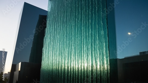 Modern Architecture Symphony: A Play of Light and Shadow on Geometric Structures, Revealing Urban Reflections in Glass.