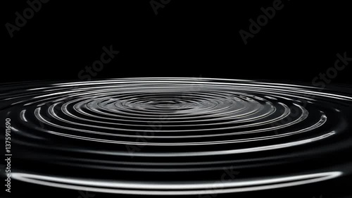 Mesmerizing concentric water ripples on a pristine black background for creative projects