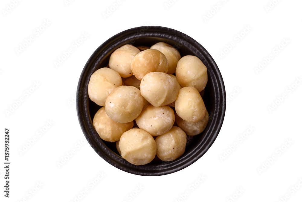 Raw peeled macadamia nut in ceramic bowl Raw peeled macadamia nut in ceramic bowl