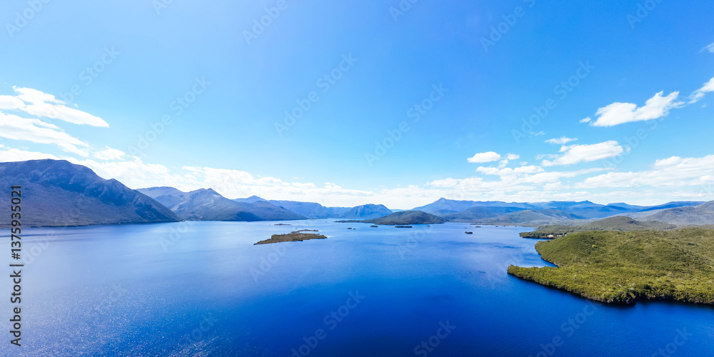 Lake Burbury and surrounding mountain landscape on a warm summer's afternoon near Queenstown Lake Burbury and surrounding mountain landscape on a warm summer's afternoon near Queenstown