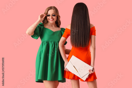Stylish young women in brig...
