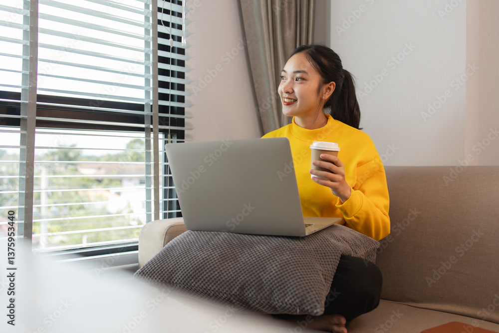 Fototapeta premium a woman is spending her holiday in the living room of her house, feeling peaceful and happy because she has done many activities that make her feel relaxed, lifestyle, apartment, sofa, couch