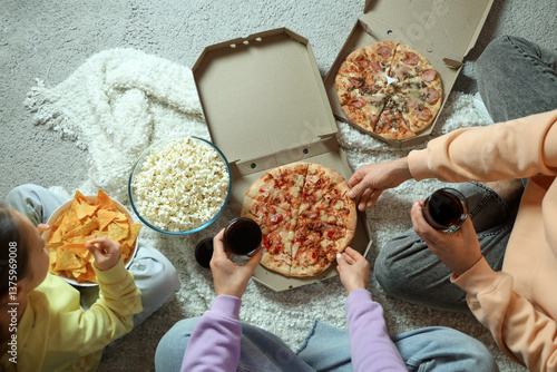 Family eating while watchin...