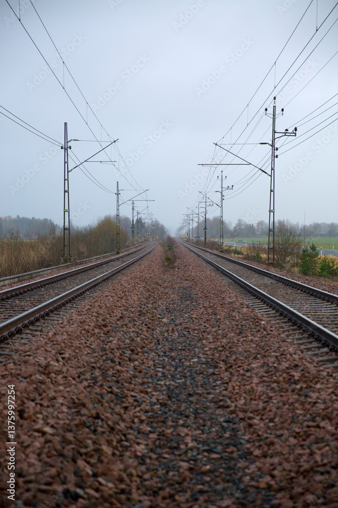 Gravel surface with railway tracks on sides Gravel surface with railway tracks on sides
